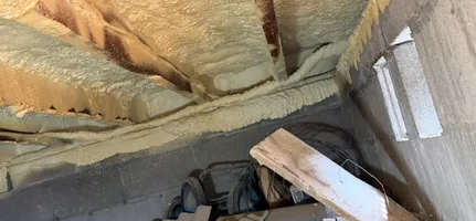 Attic framing and insulation inspected during a repair