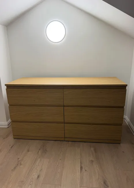 Assembled dresser in a freshly finished bedroom