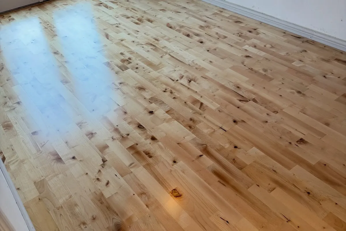 Repaired hardwood floor with new boards blended in, St. Petersburg home